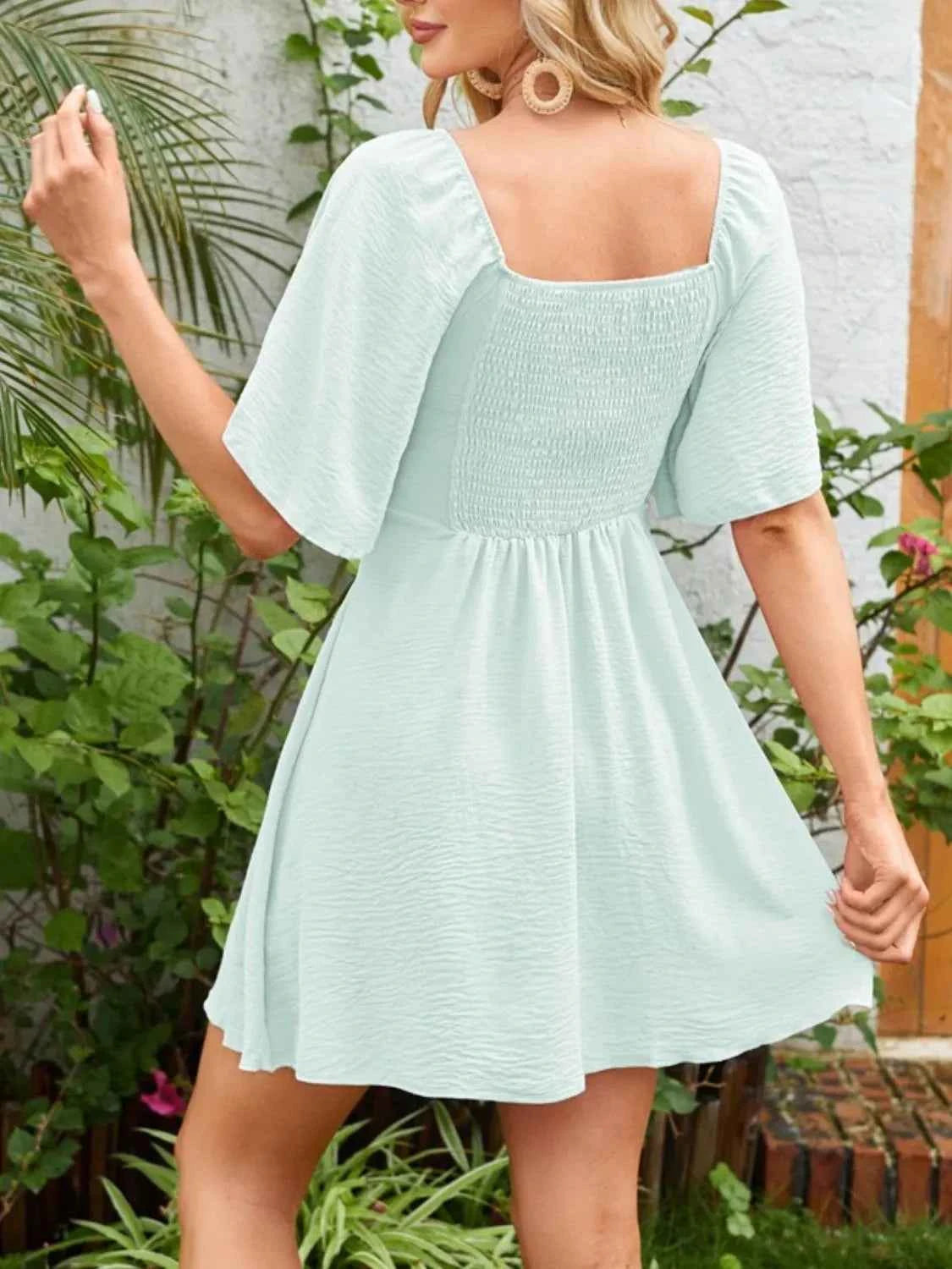 Smocked Flutter Sleeve Dress with Knotted Back and Elegant Flutter Sleeves