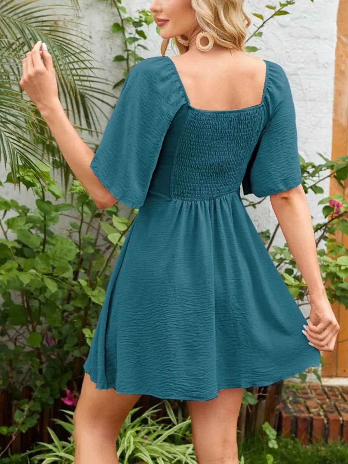 Smocked Flutter Sleeve Dress with Knotted Back and Elegant Flutter Sleeves