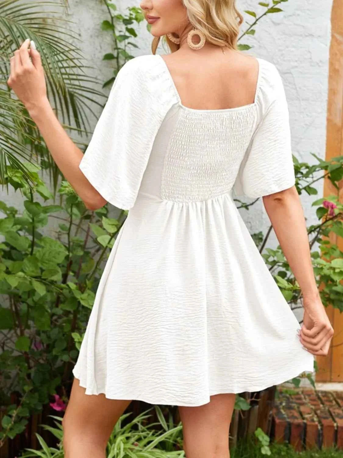Smocked Flutter Sleeve Dress with Knotted Back and Elegant Flutter Sleeves