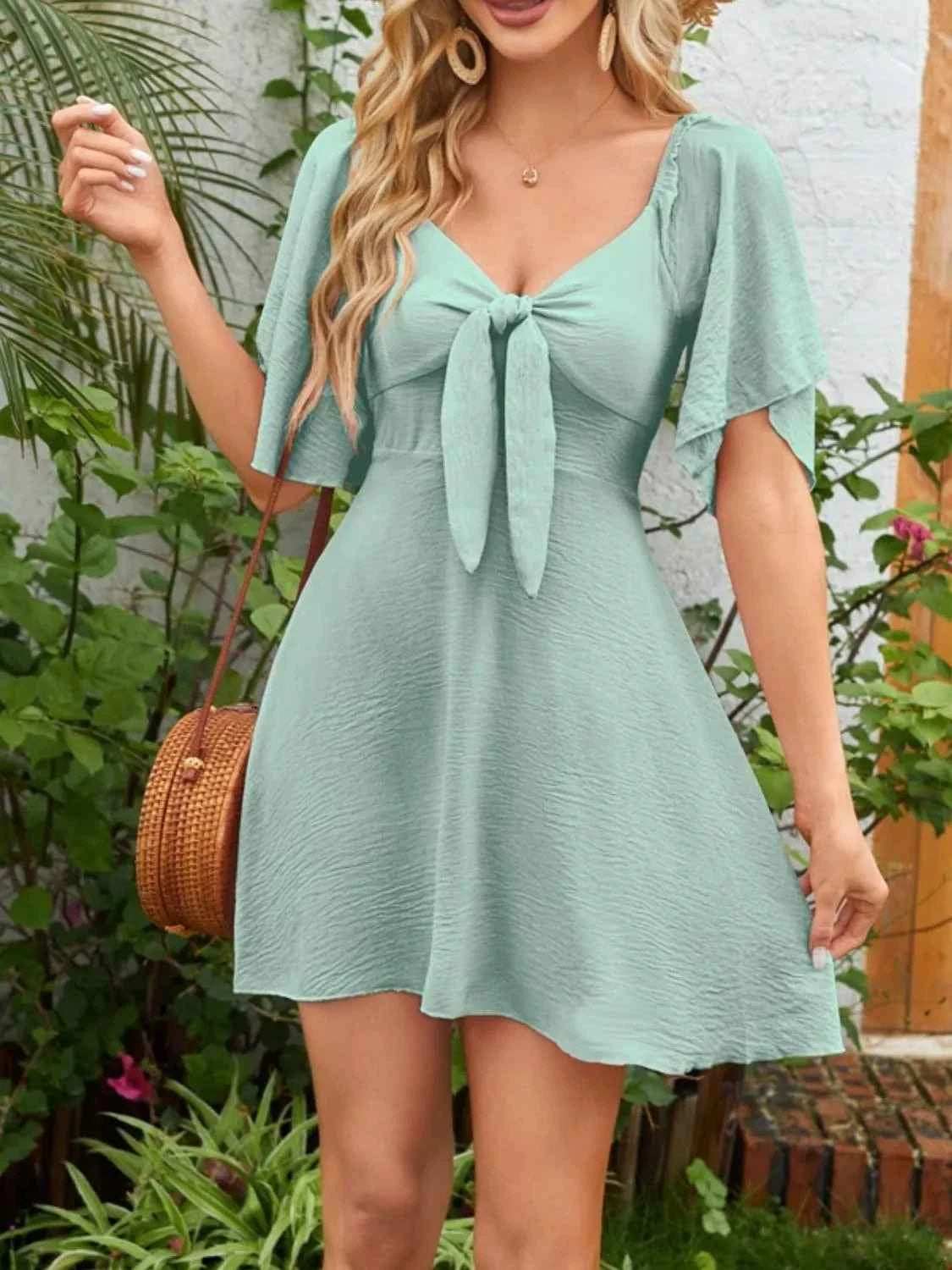 Smocked Flutter Sleeve Dress with Knotted Back and Elegant Flutter Sleeves