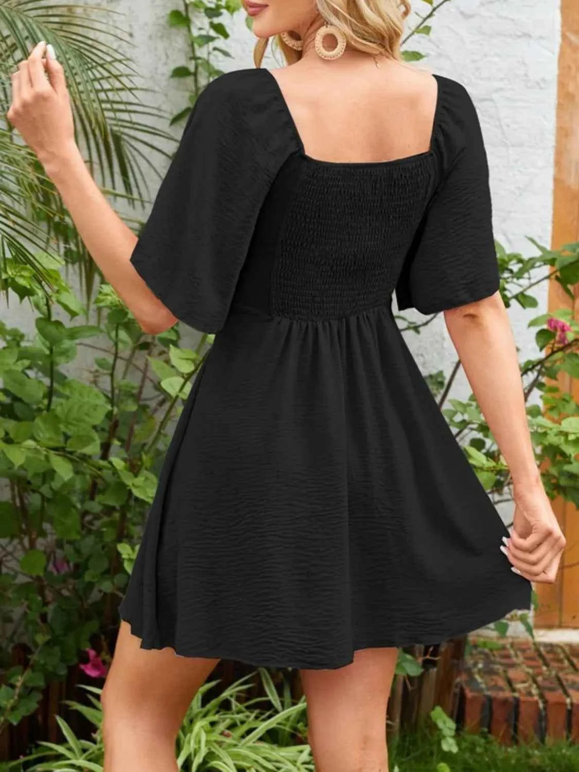 Smocked Flutter Sleeve Dress with Knotted Back and Elegant Flutter Sleeves