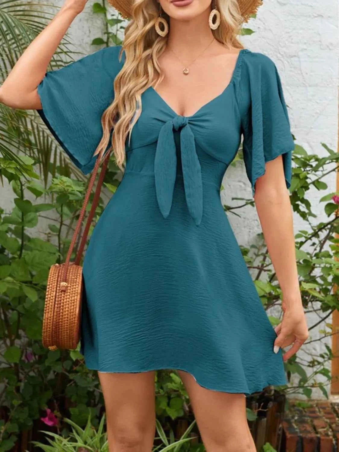Smocked Flutter Sleeve Dress with Knotted Back and Elegant Flutter Sleeves