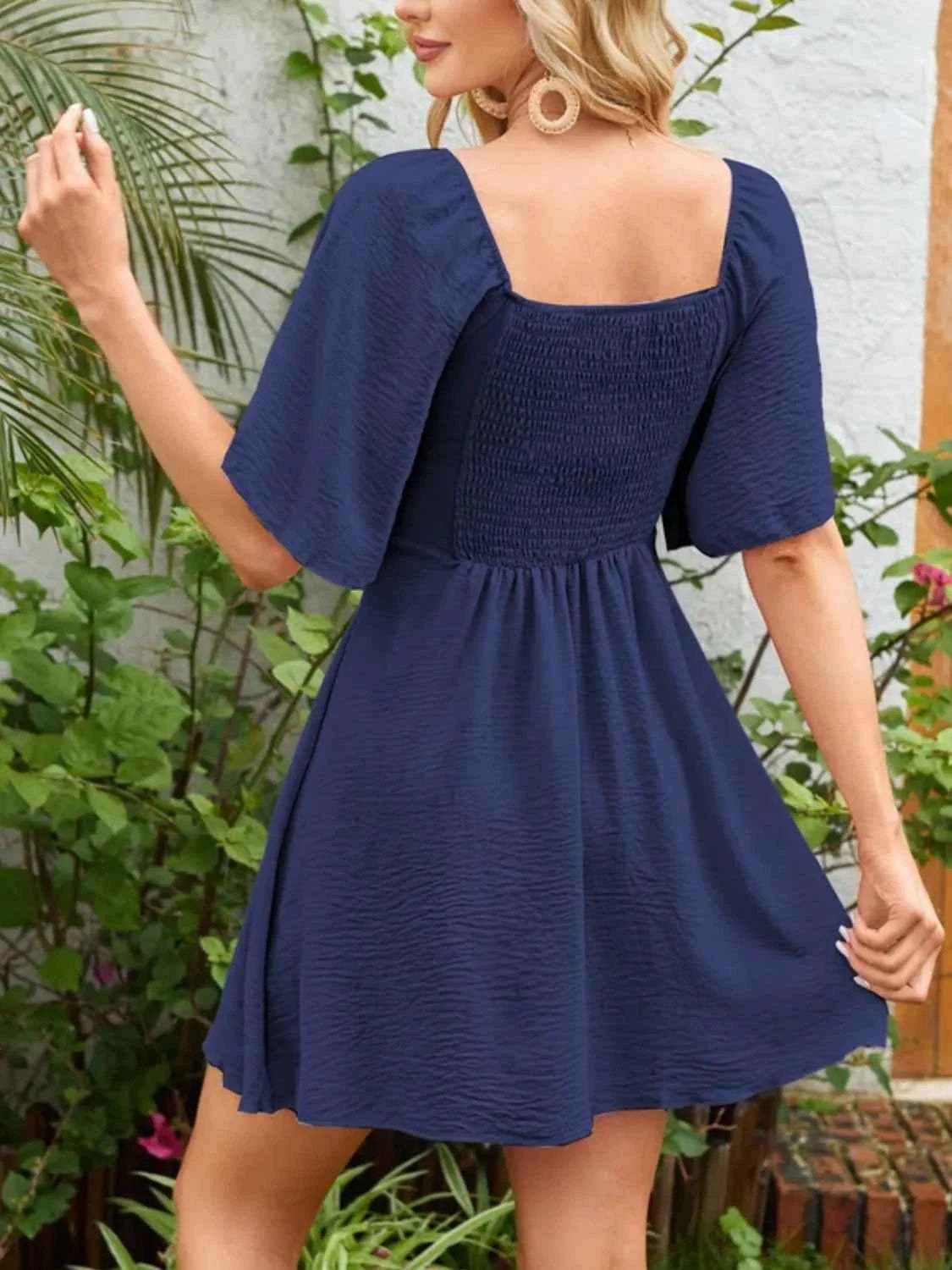 Smocked Flutter Sleeve Dress with Knotted Back and Elegant Flutter Sleeves