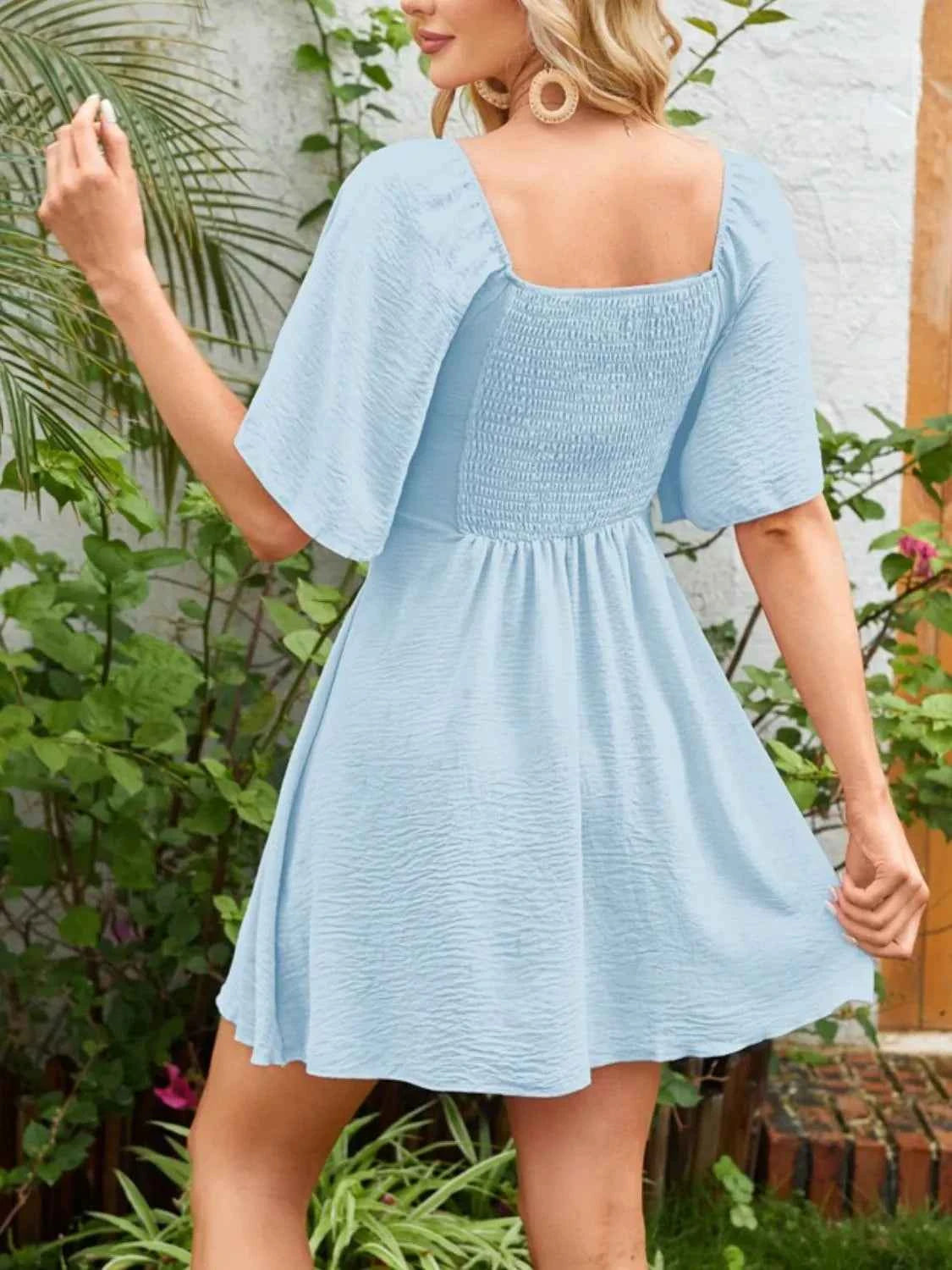 Smocked Flutter Sleeve Dress with Knotted Back and Elegant Flutter Sleeves